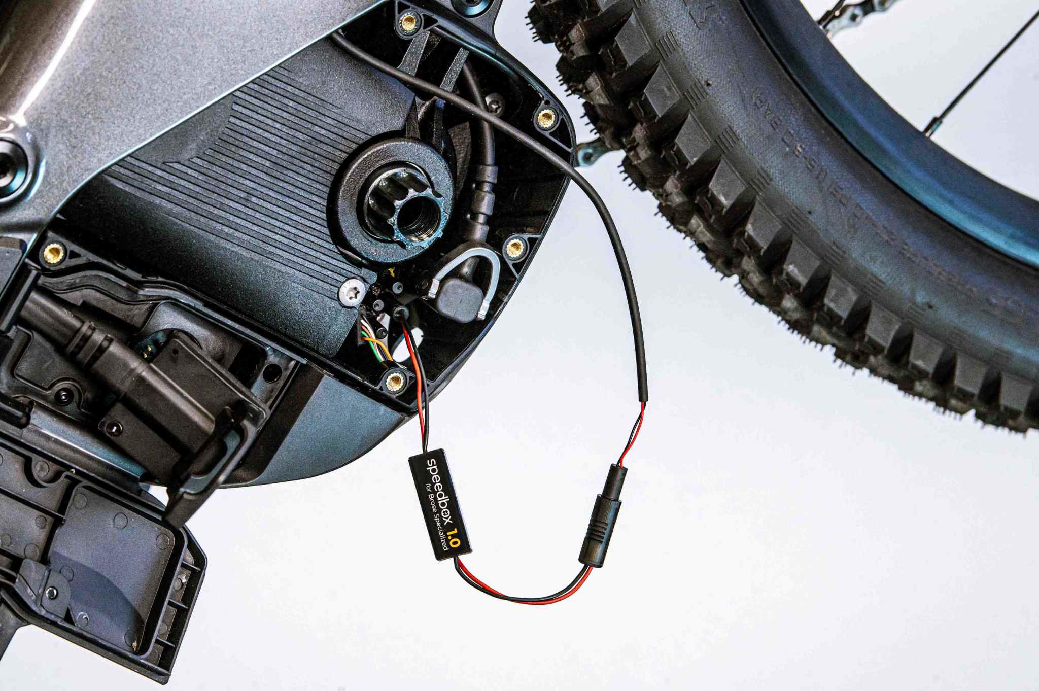 SpeedBox 1.0 module installed on Brose e-bike motor for speed limit removal and accurate display